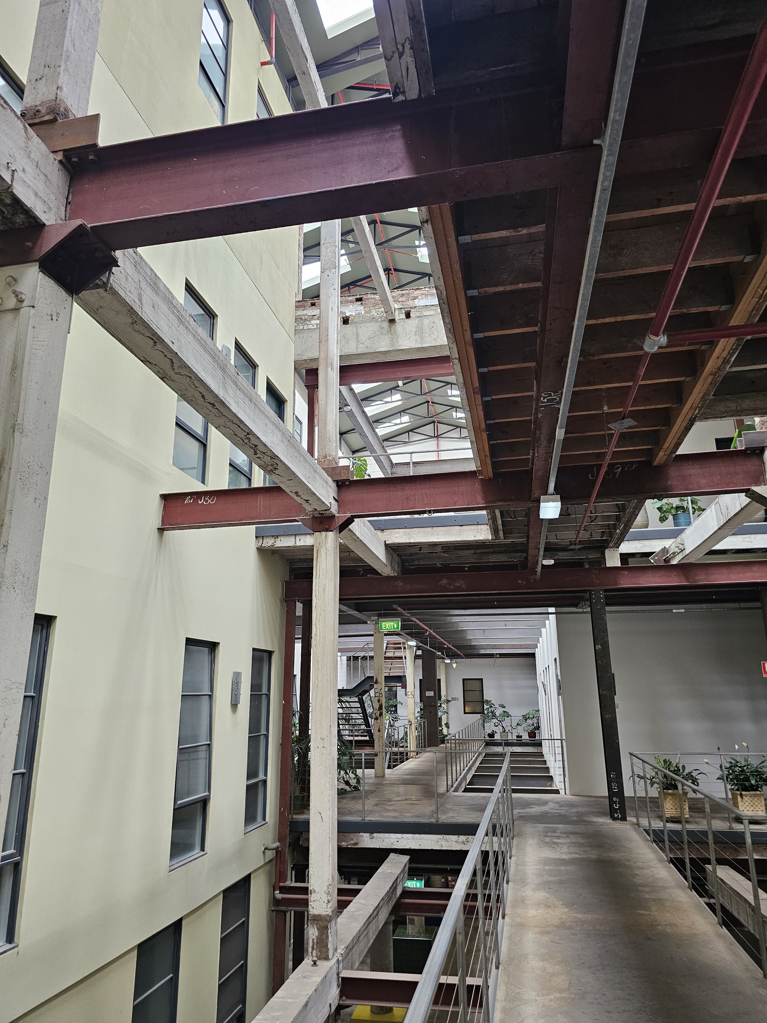 Multi-level interior with exposed steel beams and walkways