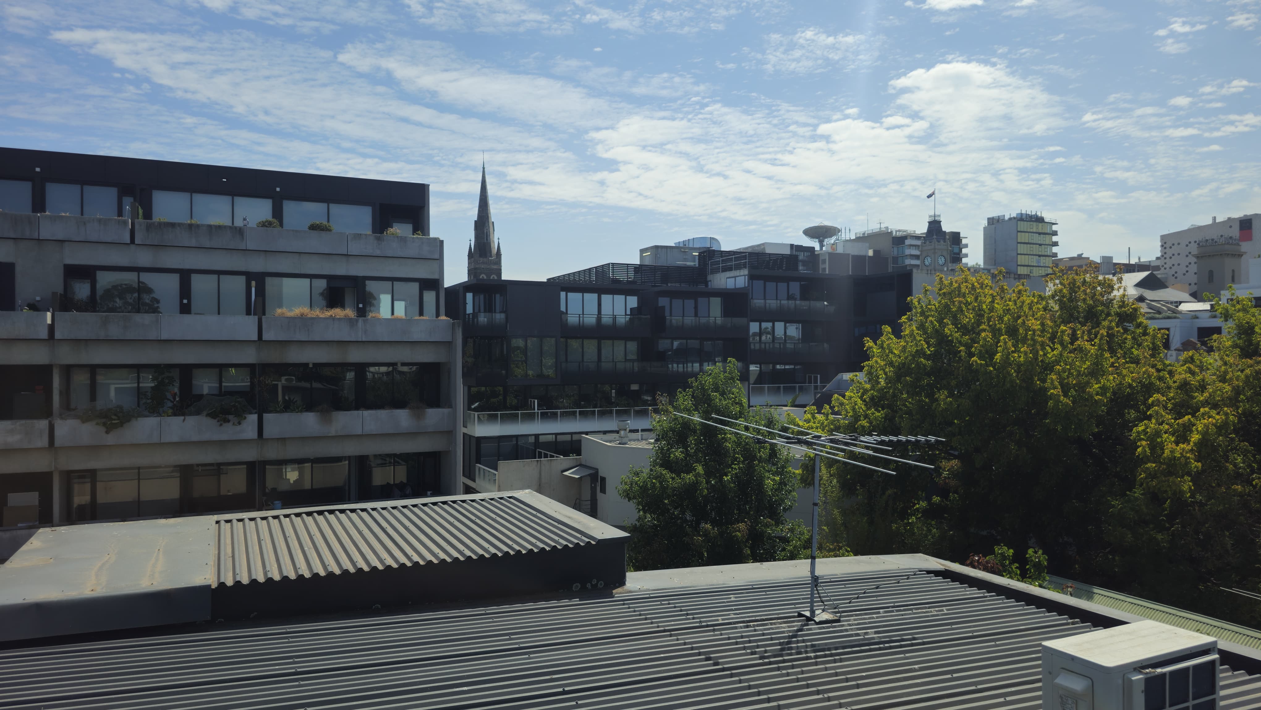 Urban rooftops and modern apartments with city skyline